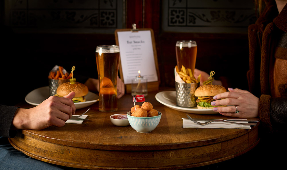 Intimate dining with burgers, beer, and snacks at a welcoming pub.