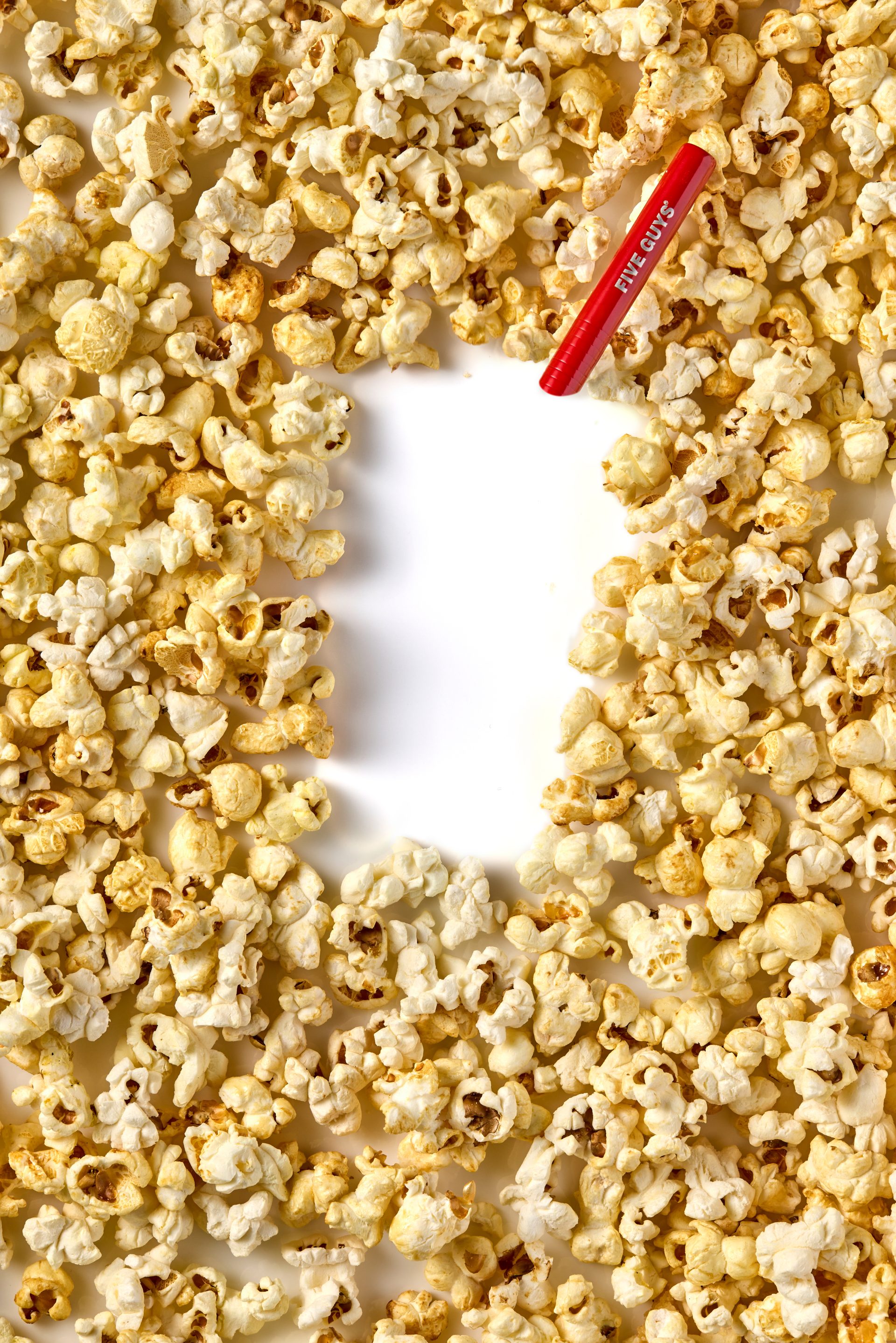 Popcorn background with a central void and a red knife labeled THE CUT.