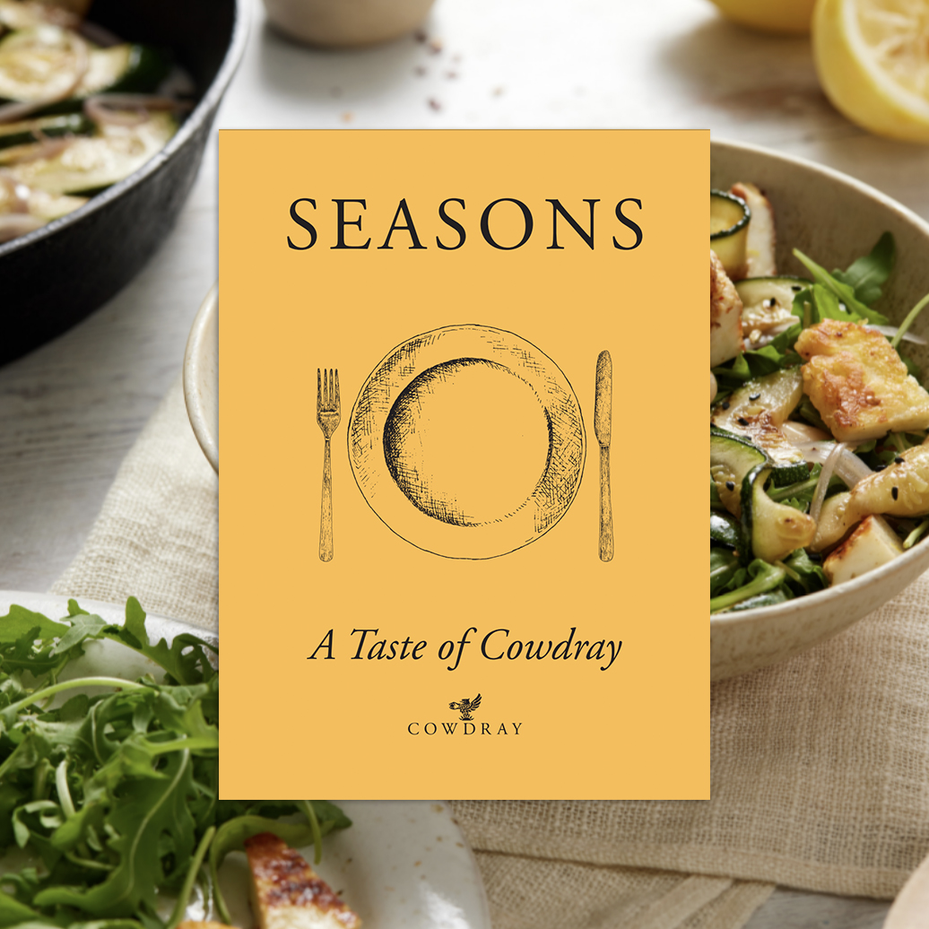 Seasons: A Taste of Cowdray cookbook cover with seasonal salad and grilled vegetables
